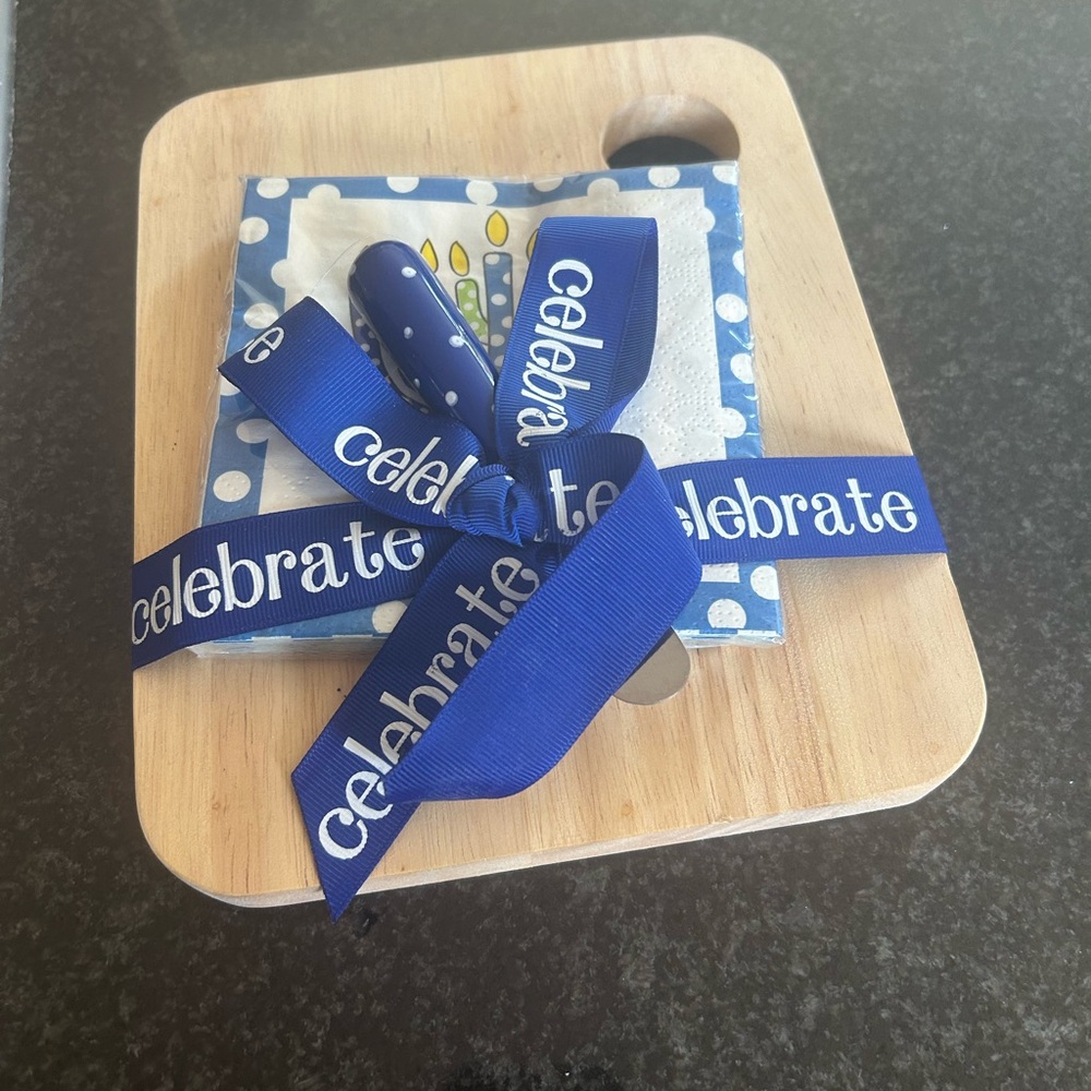Celebrate Hanukkah with a small serving board, spreader and festive napkins